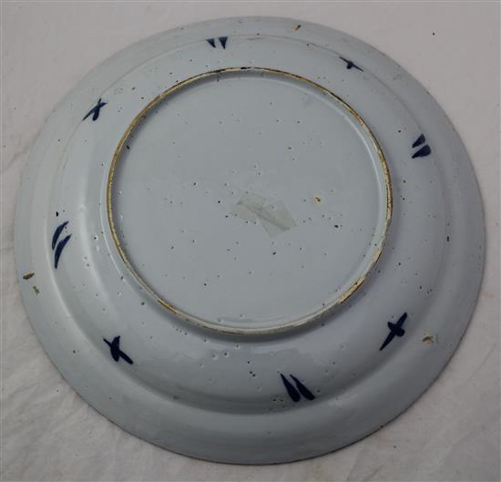 Two English delft ware chargers, 33.5cm and 34.5cm, latter with small area of restoration